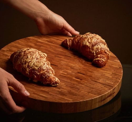 A croissant filled with Swiss and mozzarella cheese.